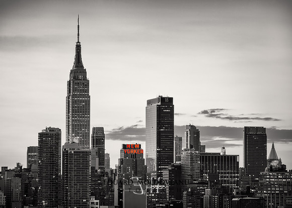 Black and white version of the New York City skyline with Empire State Building and The New Yorker, two landmarks of the city.